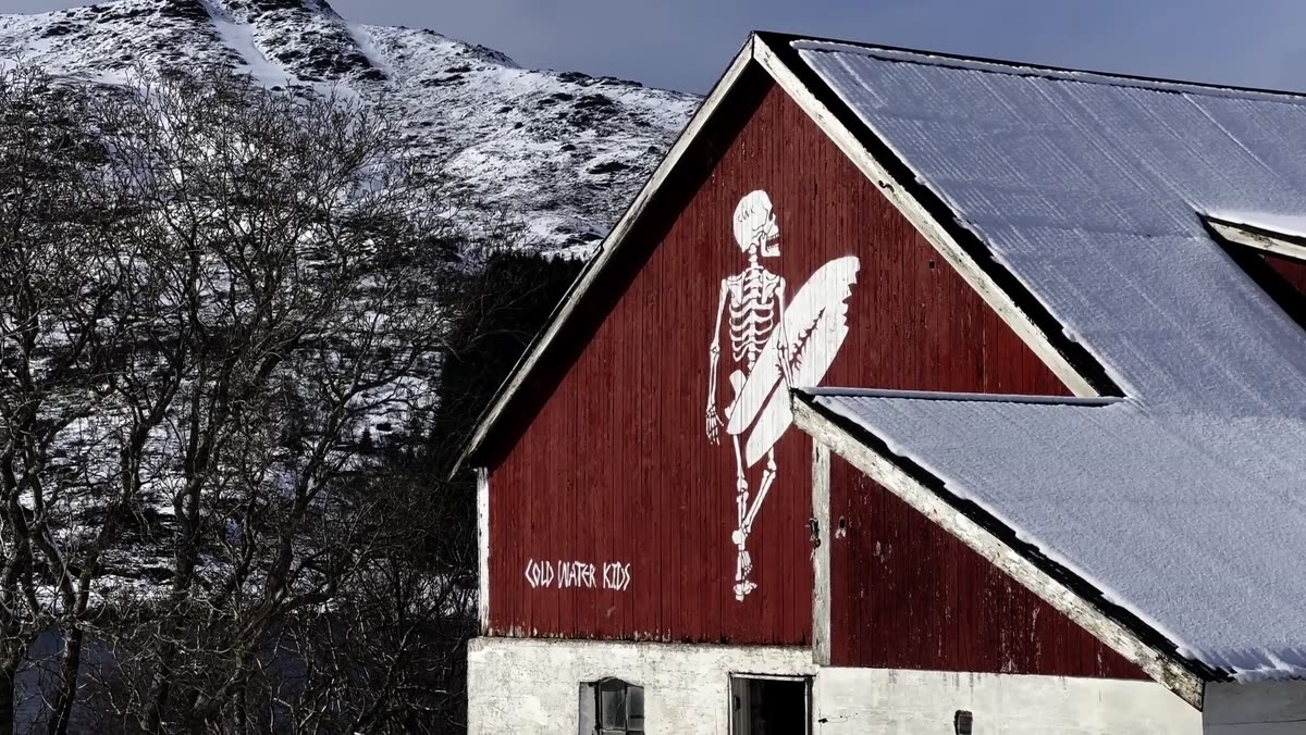 Hand-painted Cold Water Kids skeleton mural on a Norwegian barn